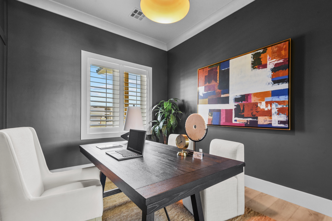 Elegant home office with bold art, showcasing Las Vegas luxury property staging. | Utopia Luxury Home Staging & Design