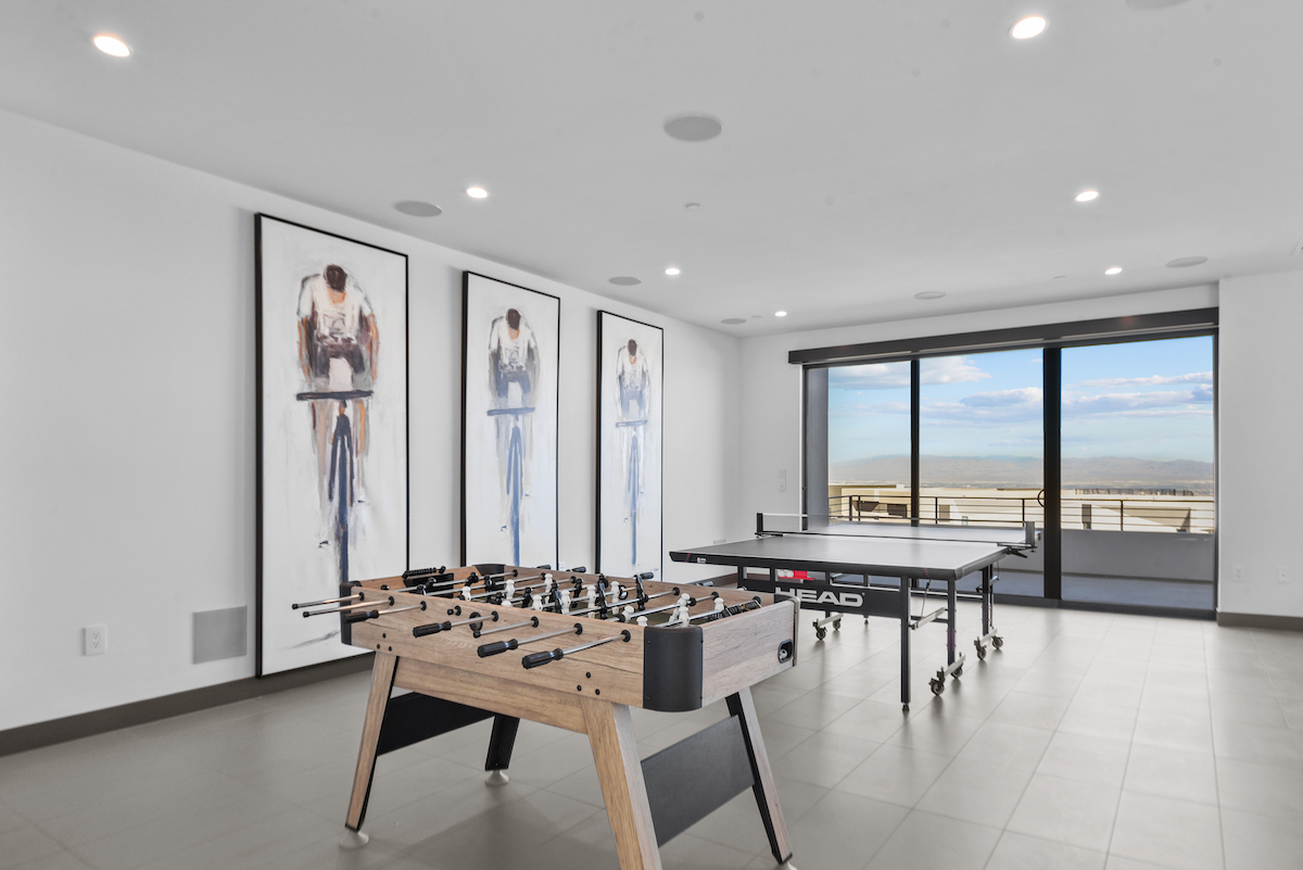Luxury home staging Las Vegas enhances a sleek game room with stunning views. | Utopia Luxury Home Staging & Design