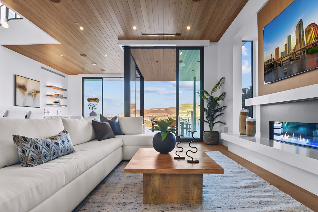 Modern living room staging with white sofa and wooden table. | Utopia Home Luxury Home Staging & Design